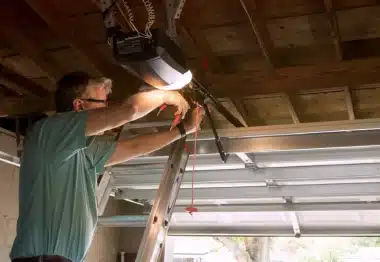 IGDS technician fixing a garage door lifter